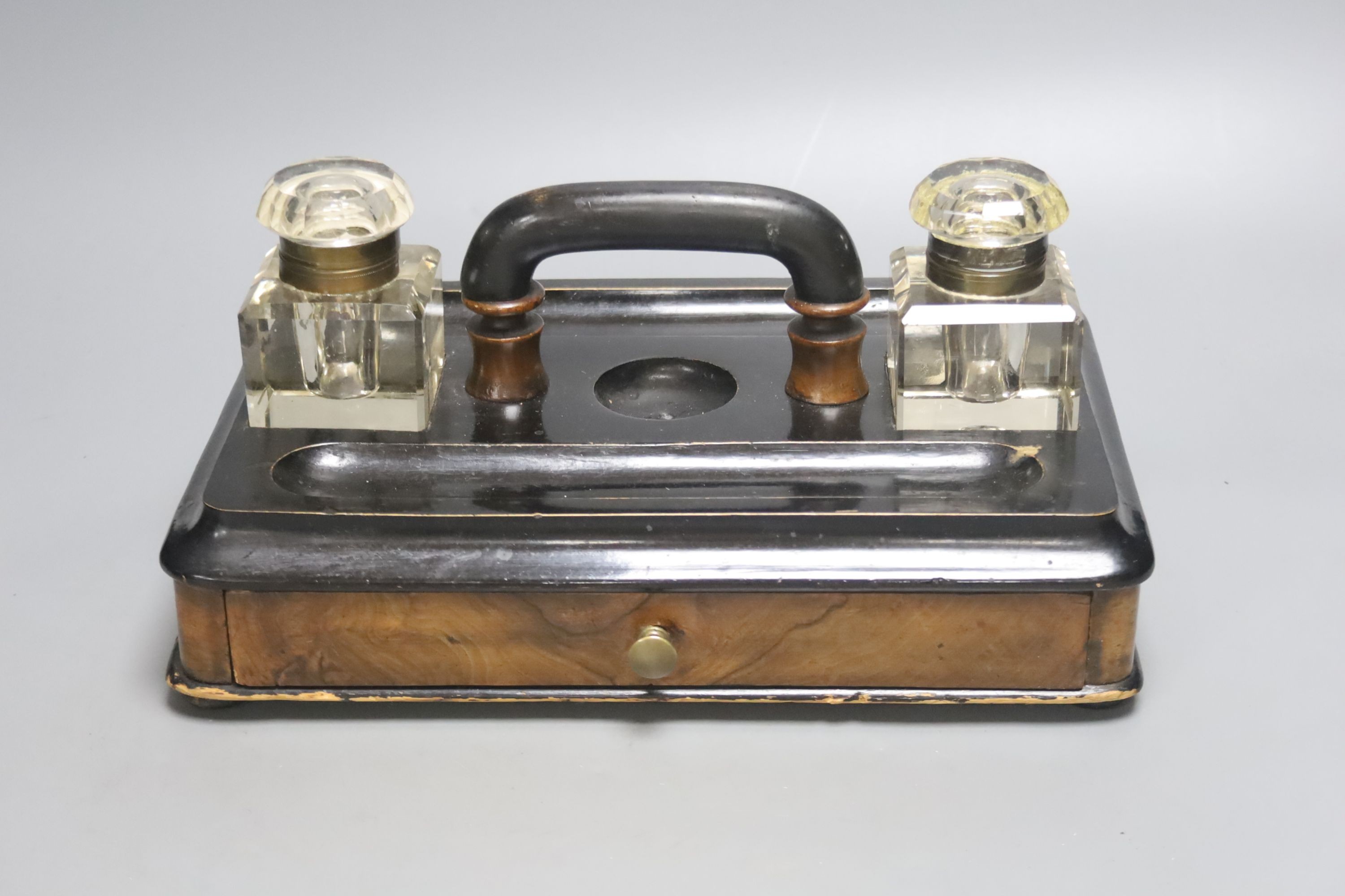 A Victorian walnut and ebonised desk stand with single drawer, 30cm wide together with a framed Continental porcelain portrait miniature